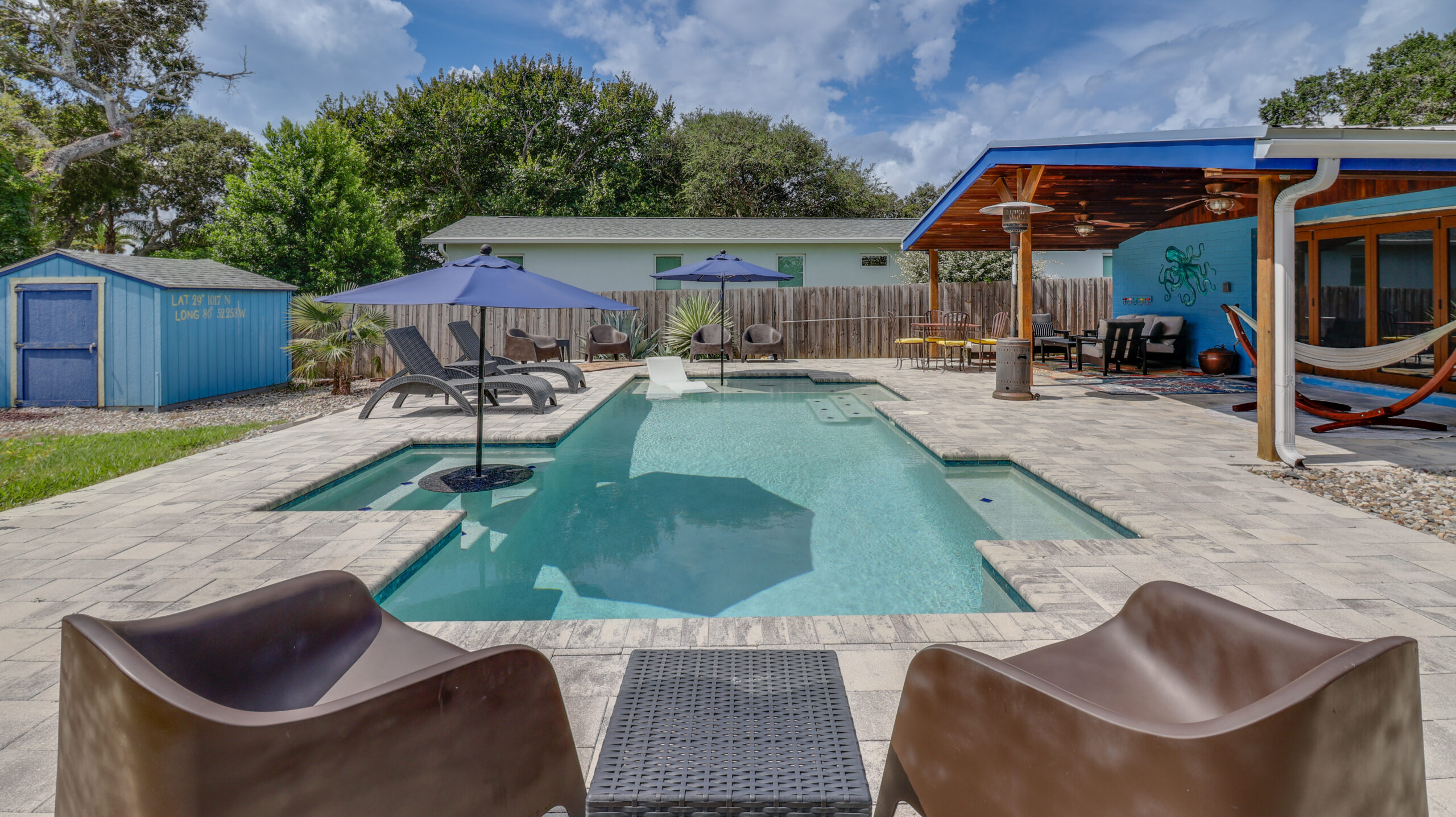 Private backyard pool and covered patio at Casa Nova Getaway in New Smyrna Beach